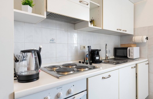 San Giovanni Apartment | [Loft Luminoso] a 15 minuti dal Colosseo con aria condizionata, WI-FI e vista.