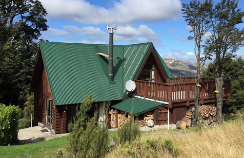 Mt Lyford Cabin | Log cabin in the mountains with indoor climbing wall, perfect for a family.