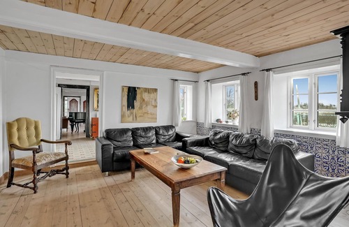 Emmerlev House | Look forward to a beautiful sea view from the terrace of this vacation home near the beach!