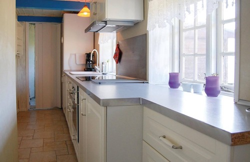Nymindegab House | Look forward to a relaxing holiday in this charming holiday home with a traditional thatched roof.