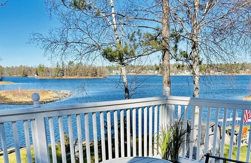 West Branch Cottage | Loon Lookout has its own beach and is on a private lake in West Branch, MI