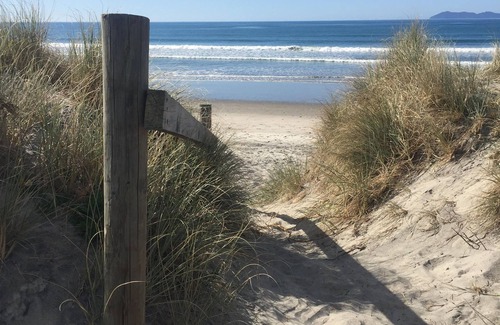 Waihi Beach House | Lovely sunny home with beach views to the front and county views at the back.