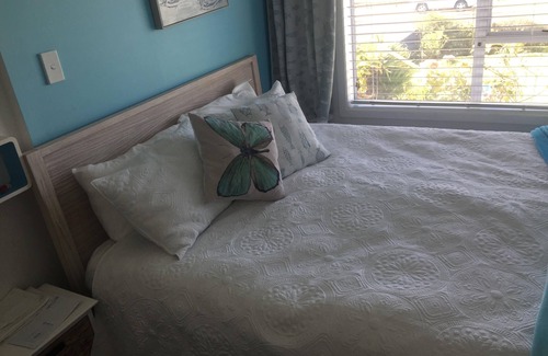 Waihi Beach House | Lovely sunny home with beach views to the front and county views at the back.