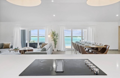 Hartswell Villa | Luxury beachfront villa with dock and a private large heated pool. For 10 people