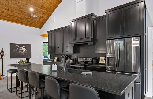 Rogers Cabin | Luxury cabin lined by trees with pool, oversized sunroom, hot tub & grill