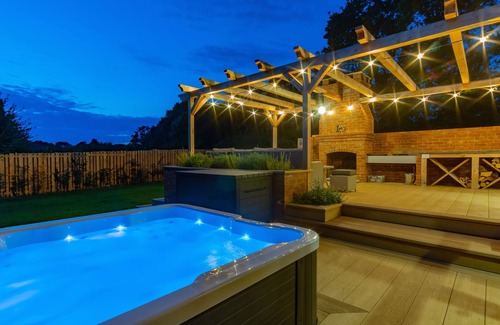 Funtington Cottage | Luxury Cottage near West Wittering with hot tub and outdoor fireplace.