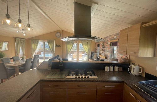 Tattershall Cabin | luxury lakeside lodge with a sunken hot tub on bull rush a peaceful feature lake @Tattershall lakes