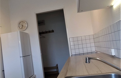 Brabrand Condo | M H Homes Apartments with a fully equipped kitchen.