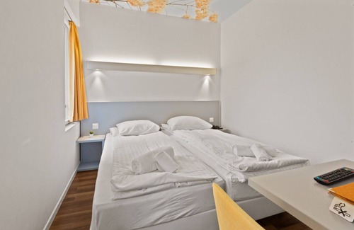 Sierre Hotel | Magnificent triple room in the heart of Sierre