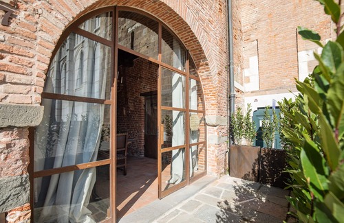 Lucca Historical Center House | Medieval Tower House alongside the Cathedral San Martino Bell Tower built 1204.