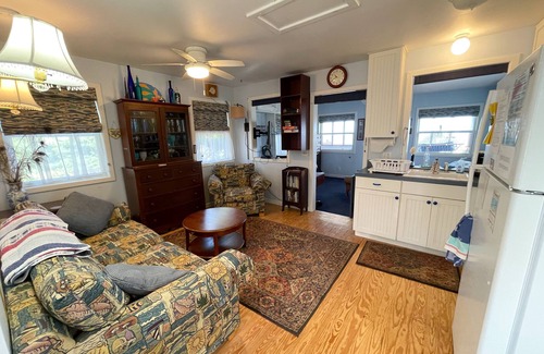 Ocracoke House | Minnow: Waterfront efficiency cottage, hot tub, private sandy beach.