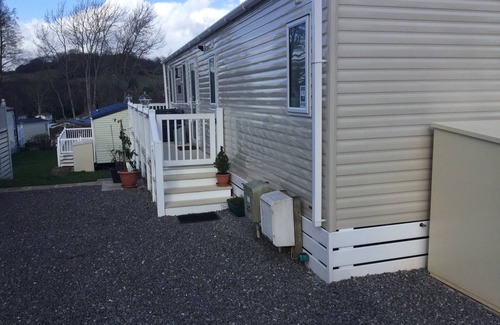 Dawlish Warren House | Modern 2 bed caravan with surrounding decking and patio; sleeps up to 6 people