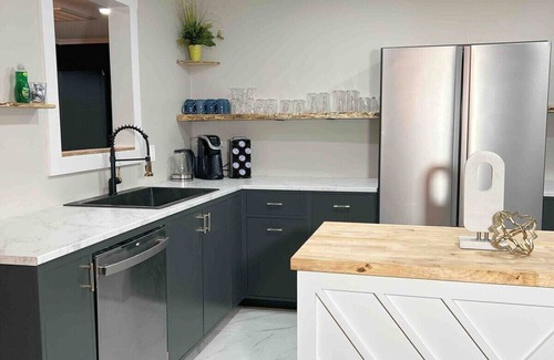 Decatur House | Modern 4BR Retreat Games Fire Pit Movie Room