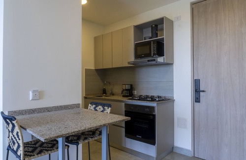 Papare Apartment | Modern Apartment with Pool, Beach Access & Nature Views.