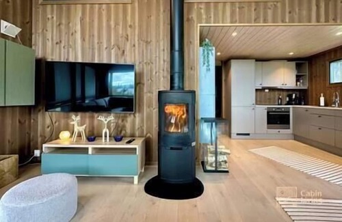 Svingvoll House | Modern cabin Skeikampen with ski-in/out cross country trails & great view