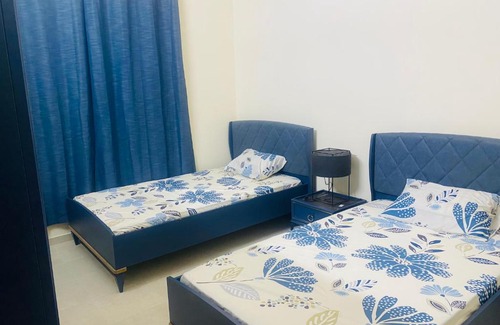 Emirates City Apartment | Modern comforts of 311 to Dubai