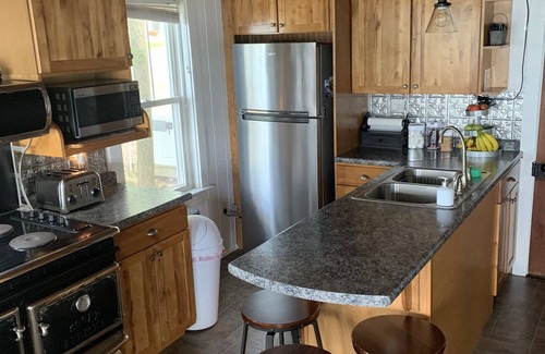 Oakland Cottage | Modern Lakefront Camp on East Pond - cozy fire pit, 3 kayaks, canoe
