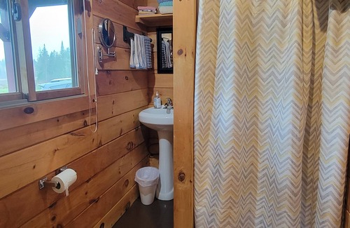 East Corinth Cabin | Modern log cabin with pond view available for rent in middle Maine.