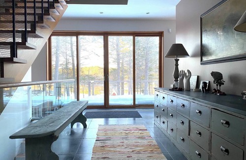 Bath House | Modern waterfront home on a private peninsula, surrounded by stunning water views on three sides