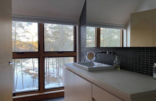 Bath House | Modern waterfront home on a private peninsula, surrounded by stunning water views on three sides