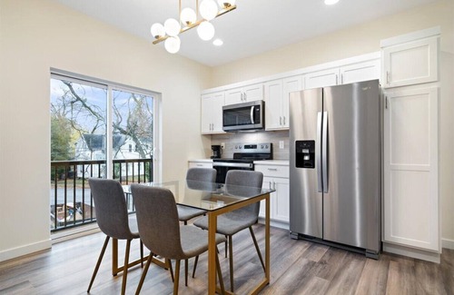Evansville Apartment | New Boutique Hotel Suite on Haynie's Corner: KING Bed, Parking, Security & More!