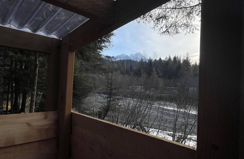 Bear Creek Cabin | New creekside yurt with mountain views next to a Salmon run creek!