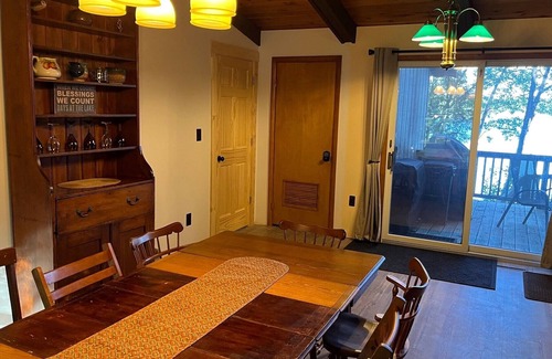 Mancelona Ski Chalet | NEW! Woods and Waters - Large, Family-Friendly, and Lakefront with Watercraft!