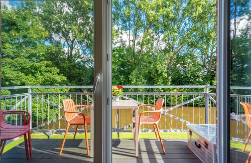 Eilsum Apartment | Newly built apartment (80sqm) with balcony directly on the water near Greetsiel!