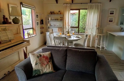 Akaroa House | Newly redecorated & beside th stream sunny seating area Spring is gorgeous here