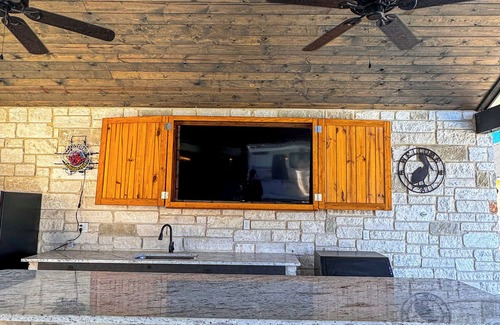 Sabinal House | NOLA styled 6-bedroom home in Concan. Sleeps 36 with AC, WiFi, Pool, Hot Tub