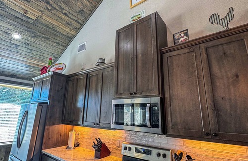 Sabinal House | NOLA styled 6-bedroom home in Concan. Sleeps 36 with AC, WiFi, Pool, Hot Tub