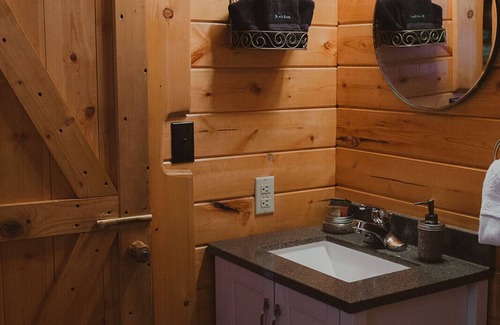 Seeley Lake Cabin | Nordic Cabin at Tamaracks Resort, a cozy log cabin with views of Seeley Lake.
