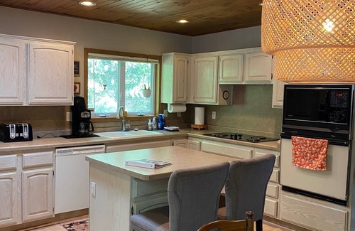 Solon Springs Cabin | Northwoods lake home with gentle slope to clear lake with sandy beach
