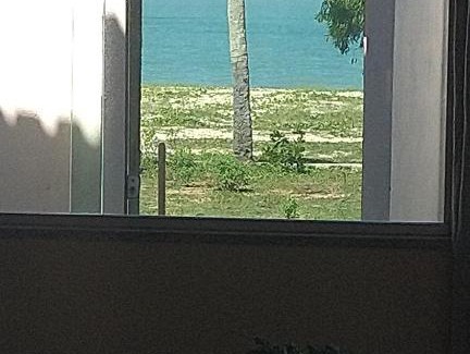 Caravelas House | O Paraíso é Aqui Abrolhos - Suíte privativa, cama de casal, ar condicionado e TV - Café da manhã de frente para o mar