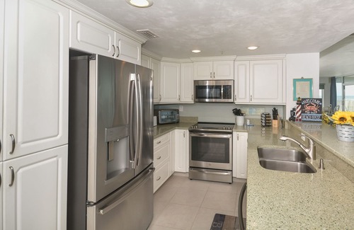 Bethune Beach Condo | Ocean Condo 104 ~ Ground Floor Corner Condo with wrap around balcony! Walk right out to Pool!