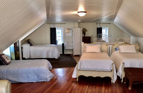 Adamsville Cottage | Oceanfront Cottage with Private Beach and Courtyard. Outside Bar & Fire Table.