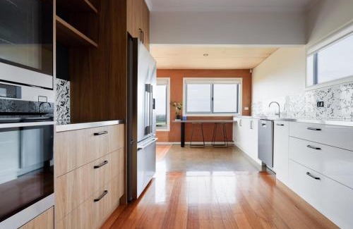 East Devonport House | Oceanfront Escape with Fire Pit & Coastal Views