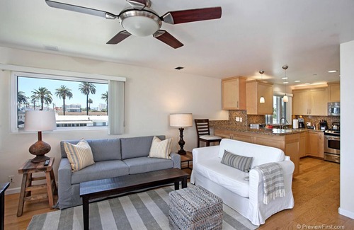 Townsite Condo | OCEANSIDE BEACH located by pier and marina! Ocean Views! Walk to Village!