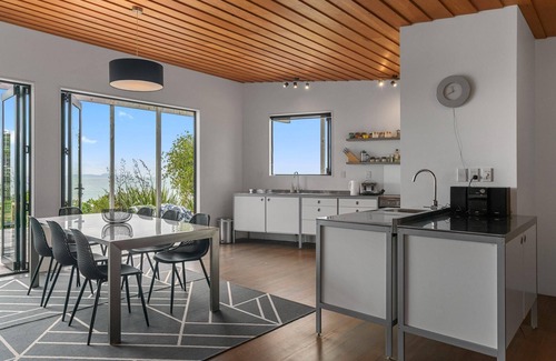 Langs Beach House | Oceanview Sanctuary - Modern, sunny holiday home with extensive decks and stunning views over Bream Bay