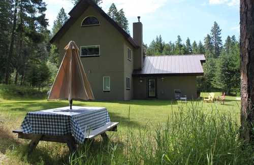 Finley Point House | Orchards & old growth forest surround this Finley Point Home.