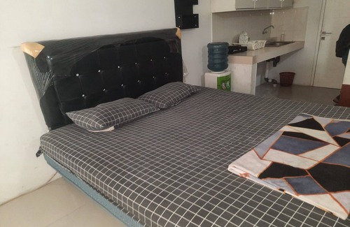 Karawang Hotel | OYO 93386 Apartemen Grand Sentraland by Mira