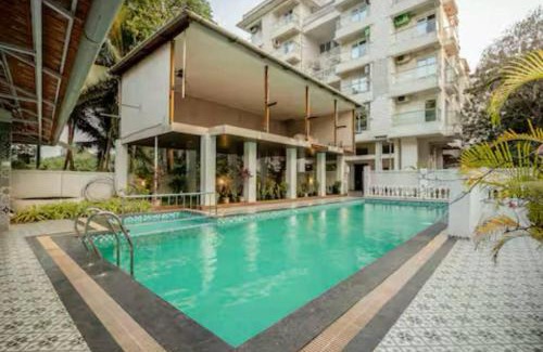 Khattalwada Apartment | Palm View 1BHK with Pool & Café - Sazo Stays