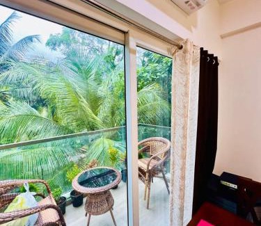 Khattalwada Apartment | Palm View 1BHK with Pool & Café - Sazo Stays