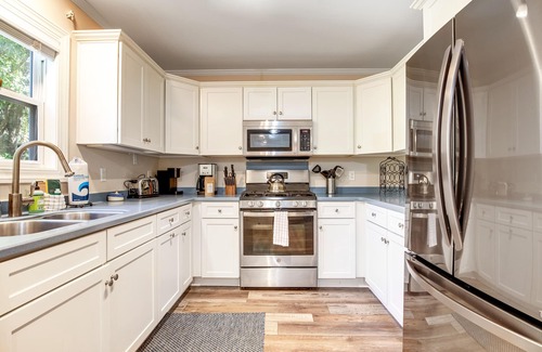 Sunset Point House | Palmetto-lined home with porches, yard & hammock - walk to beach/town