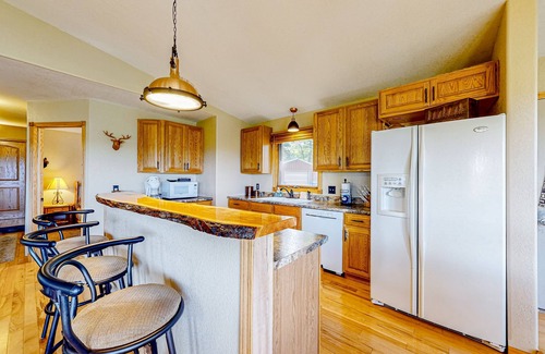 Wisconsin Dells House | Peaceful river view home with a furnished deck, firepit, central AC, & WiFi