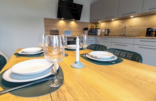 Tossens Apartment | Penthouse Lotta - view of the greenery. Stylish. Family-friendly. Quiet.