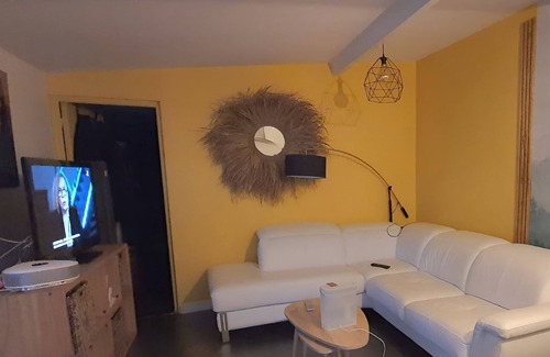 Les Luats Apartment | Pleasant outbuilding in front of a garden in a quiet area