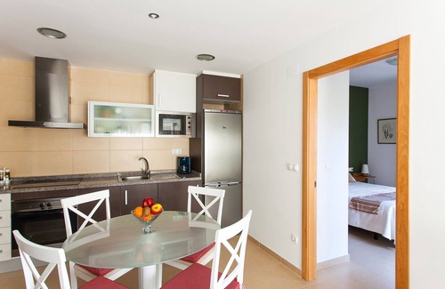 Alicante Apartment | Pool and Jacuzzi surrounded by palm trees, tranquility and open air