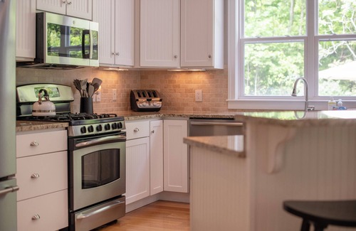 South Haven House | Pool, Hot Tub & Screened Porch w/Fireplace Overlooking Wooded Ravine
