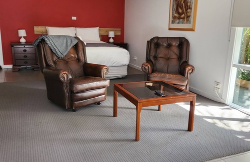 Kyneton Cottage | Pool room - tranquil spacious room with pool views.